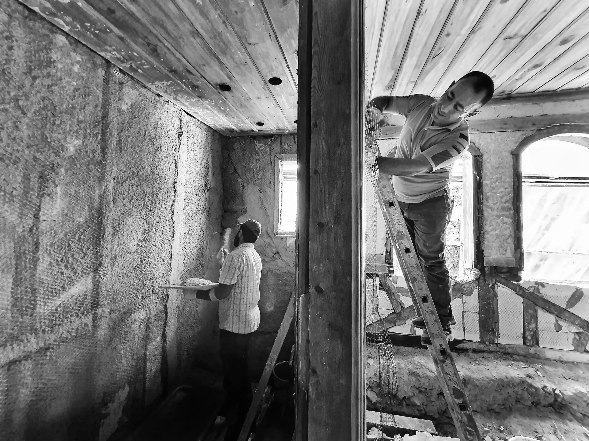 Builders at work converting a room.