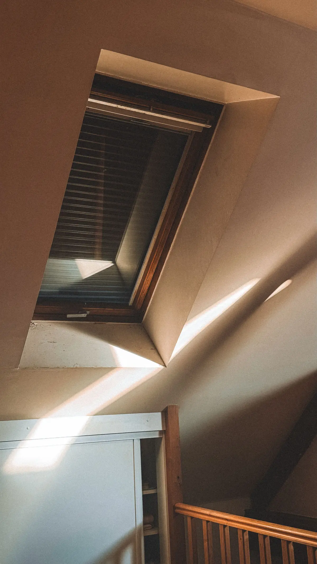 Sunlight through a roof window in a sloping ceiling.
