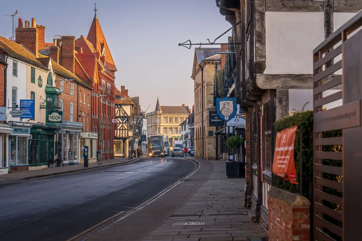 A street of old shops and timber-framed buildings in Stratford-upon-Avon.