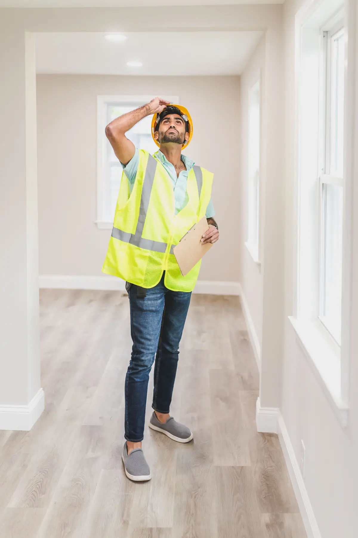 An inspector checking the inside of a house.