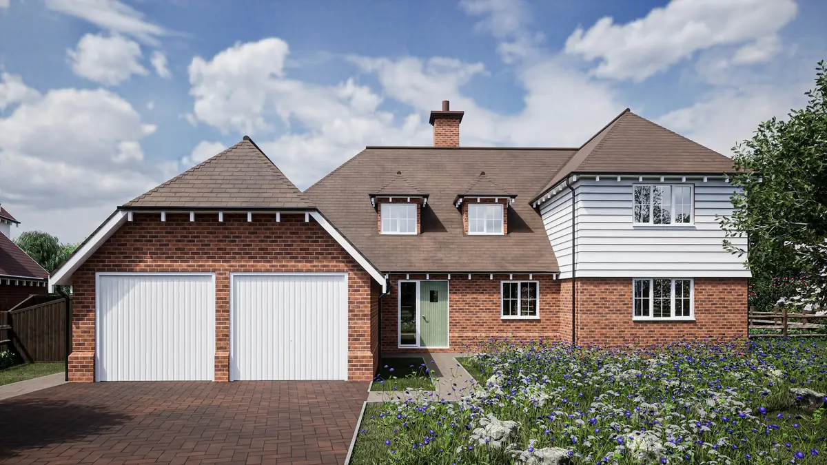 A new brick house with a double garage and two white garage doors.
