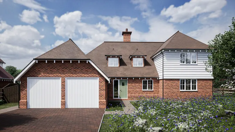 A new brick house with a double garage and two white garage doors